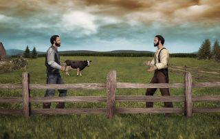 Man and woman having a respectful conversation across a wooden fence on a farm during sunset.